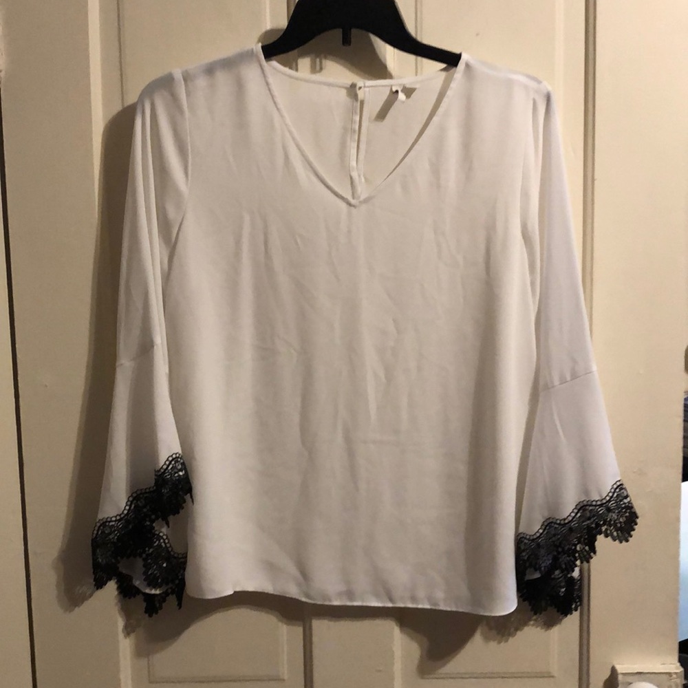 Beautiful white blouse with black lace sleeves